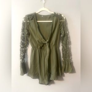 Pretty green romper for spring or summer. Lace sleeves.